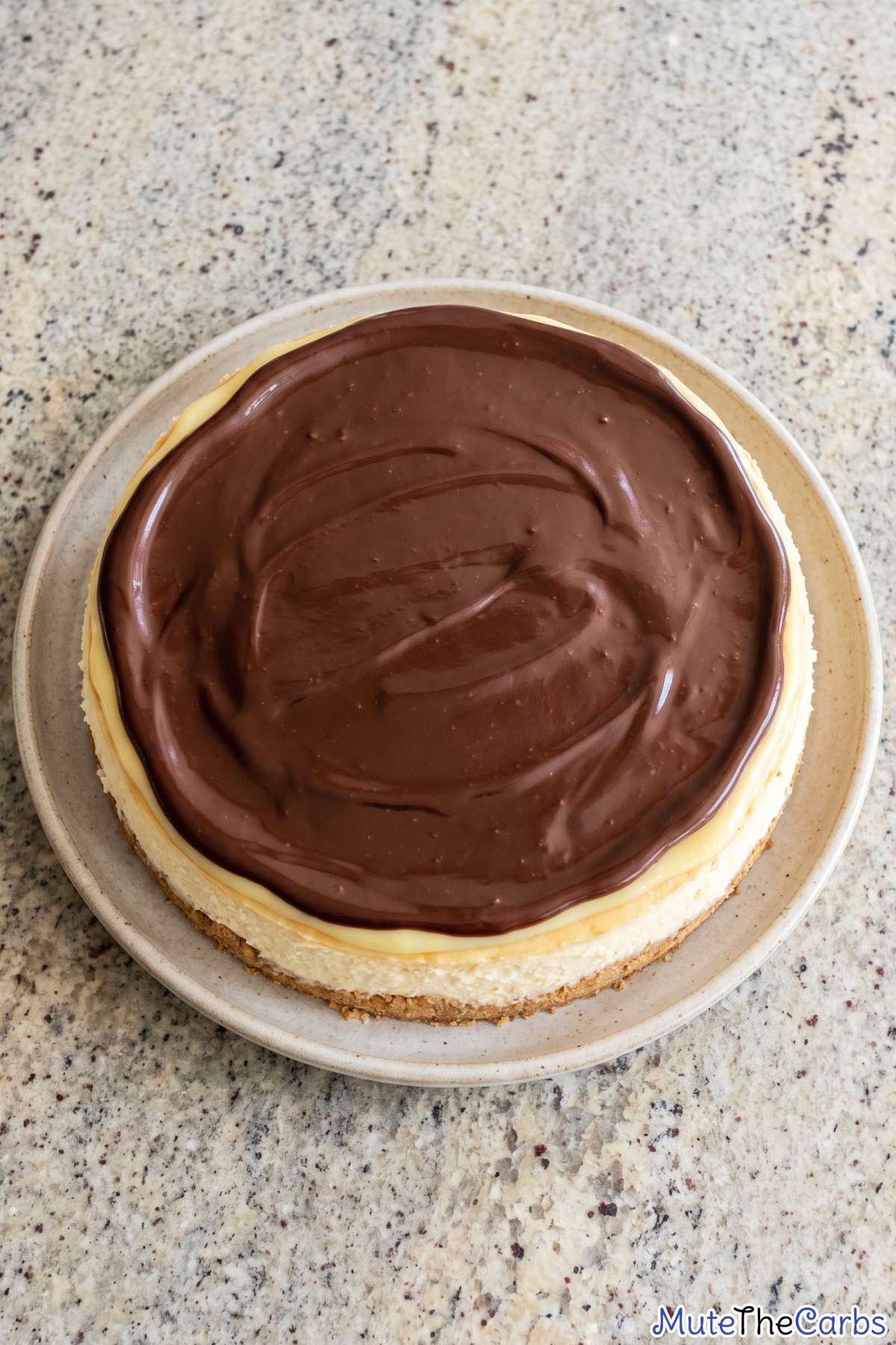 Keto cheesecake topped with chocolate glaze