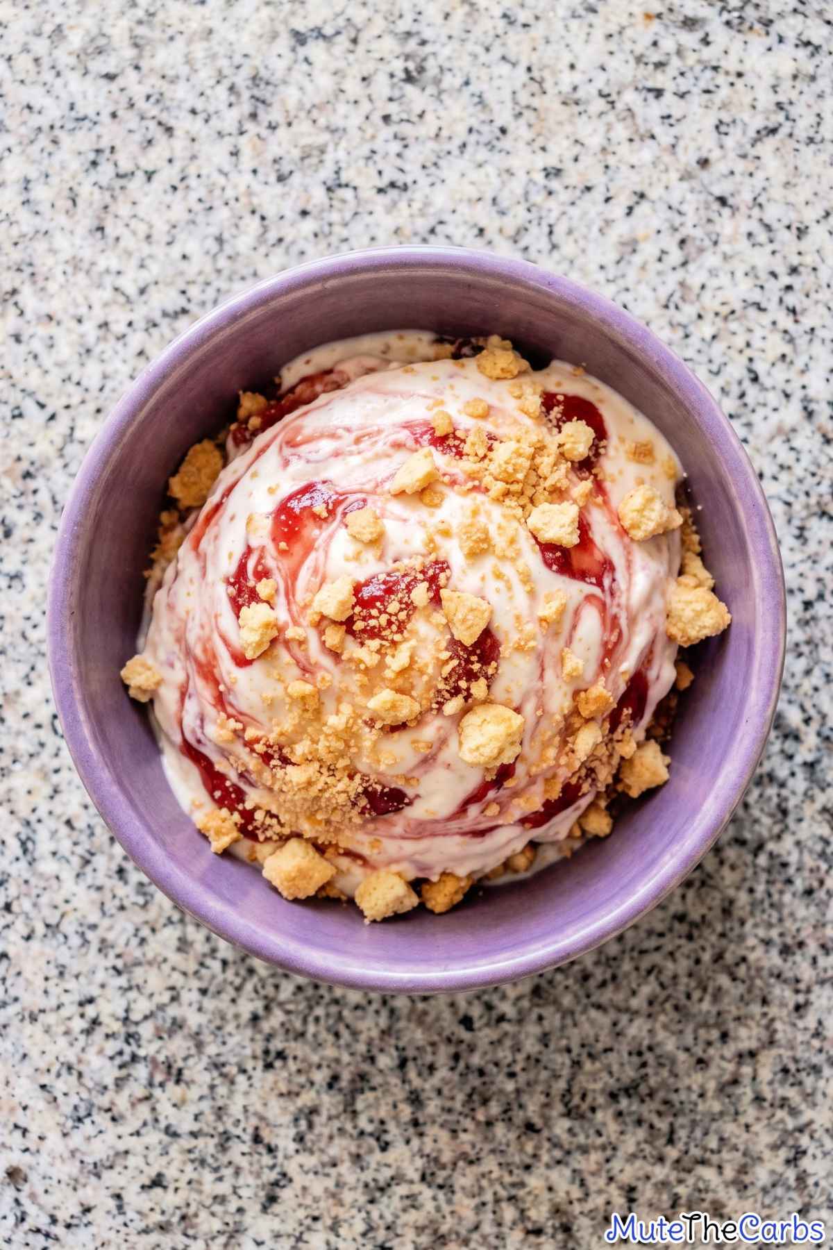 Soft keto strawberry ice cream with crumbs